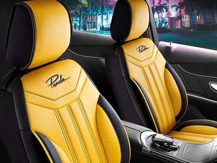 The interior of an automobile showcasing sumptuous seat adornments.
